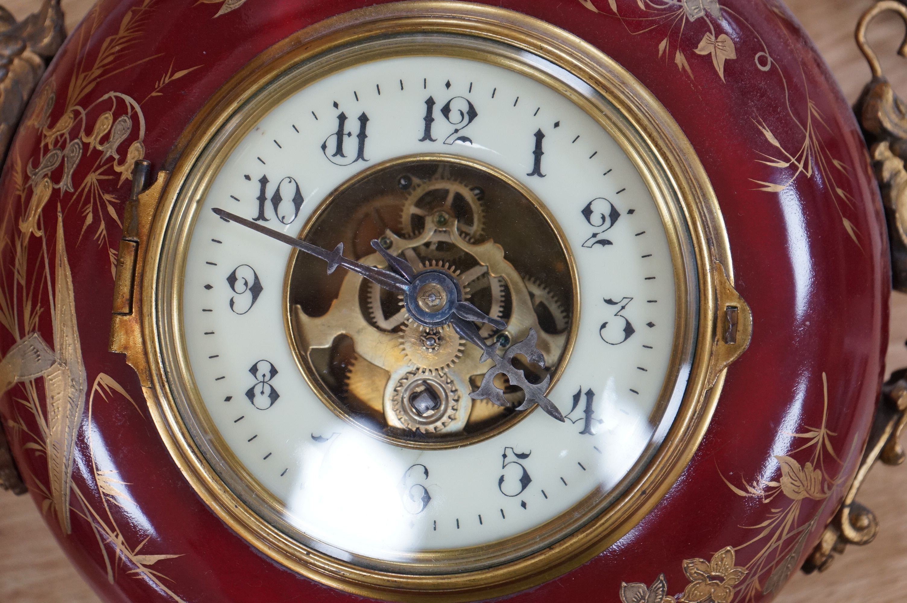 A late 19th century French hanging enamel and gilt metal wall clock. 38cm high without chain. Condition - fair to good